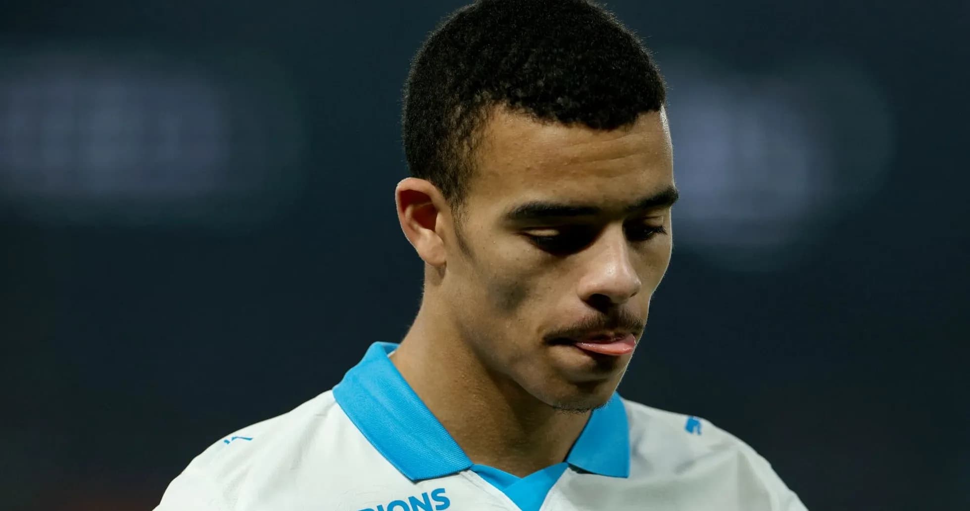 Player in white jersey looking down during match Player in white jersey looking down during match
