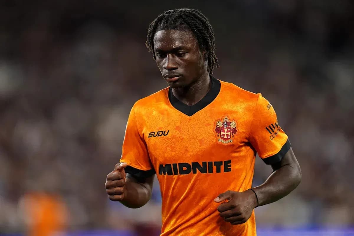 Player in orange jersey during a match Player in orange jersey during a match