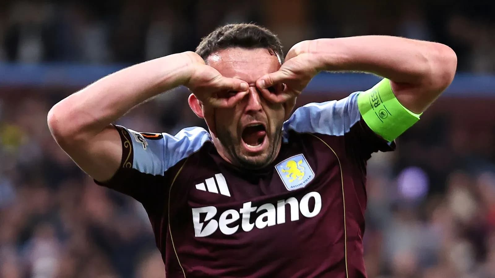 Aston Villa player celebrating with hands on face Aston Villa player celebrating with hands on face