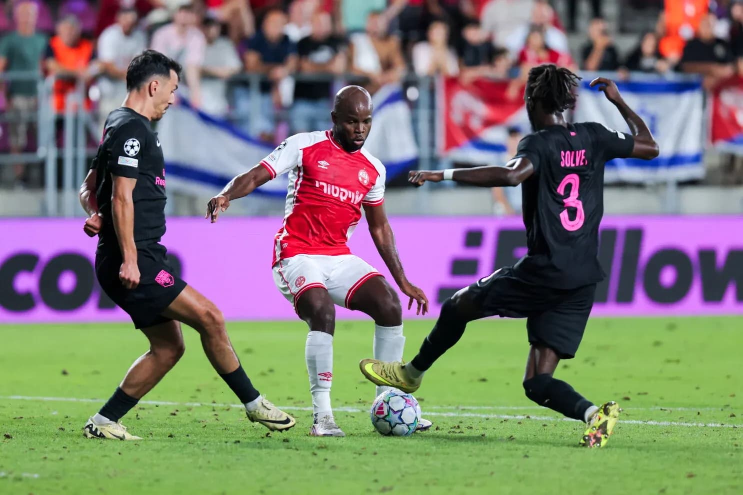 Two players contesting the ball during match Two players contesting the ball during match