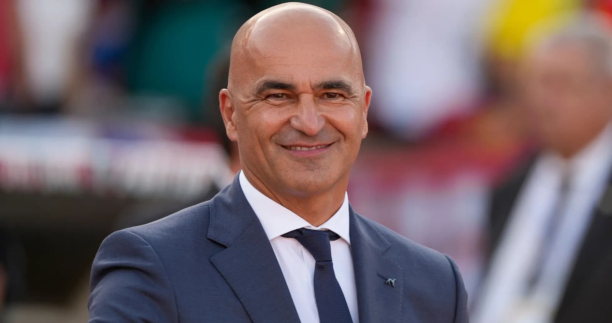 Man in suit smiling at the camera Man in suit smiling at the camera