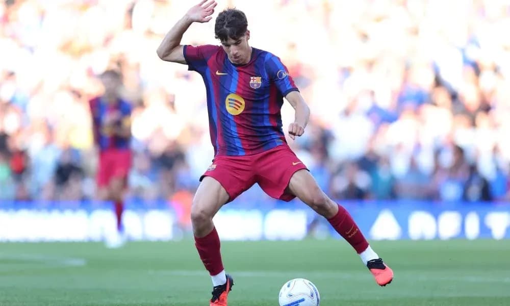 Player in Barcelona kit dribbling the ball Player in Barcelona kit dribbling the ball