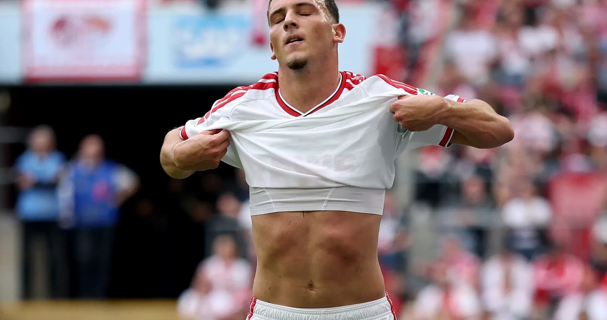 Player lifting shirt during a football match Player lifting shirt during a football match