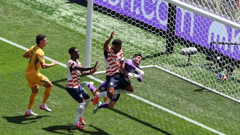 Players contesting a goal during a soccer match Players contesting a goal during a soccer match