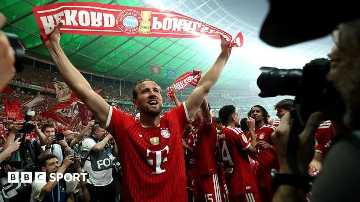 Player celebrating with fans after match victory Player celebrating with fans after match victory