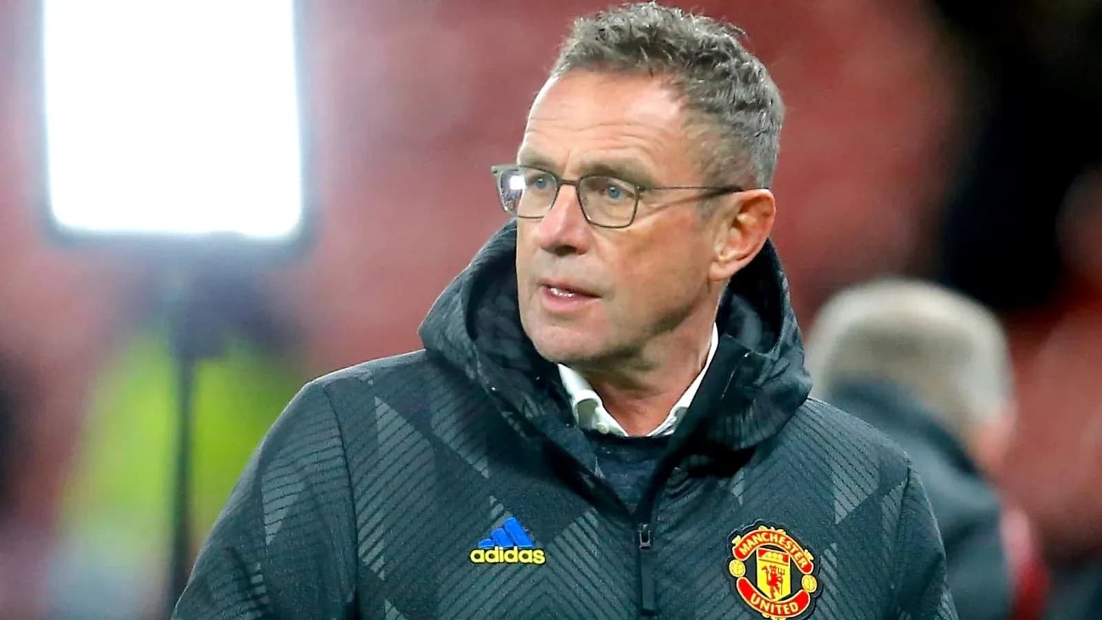 Manager wearing Manchester United jacket on sideline Manager wearing Manchester United jacket on sideline
