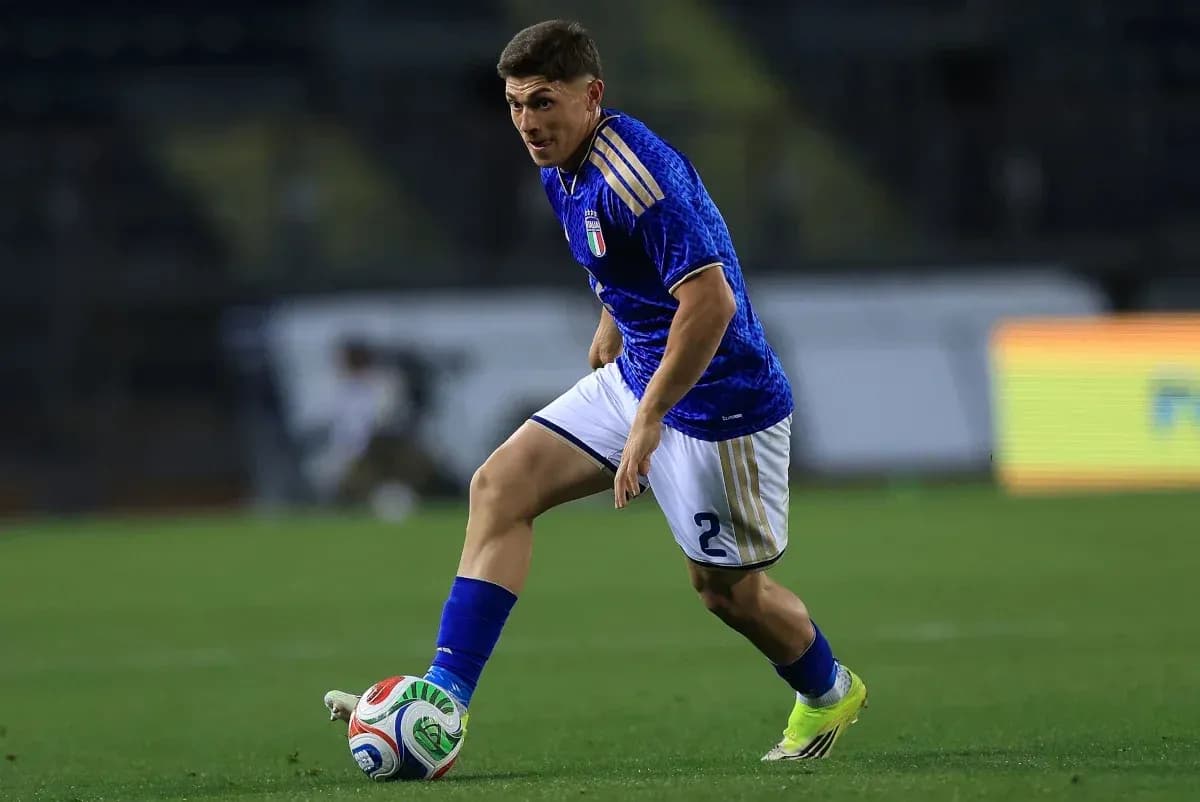 Player dribbling the ball on the pitch Player dribbling the ball on the pitch