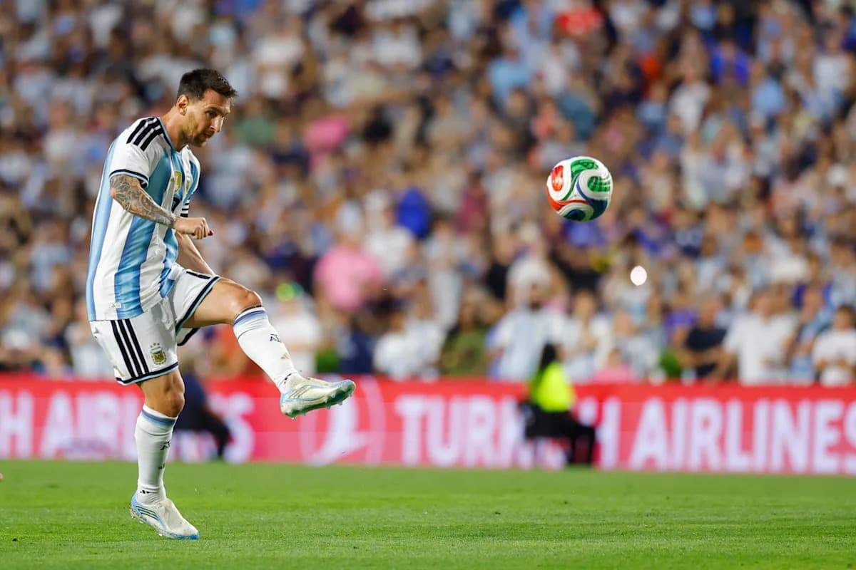 Lionel Messi kicking the ball during a match Lionel Messi kicking the ball during a match