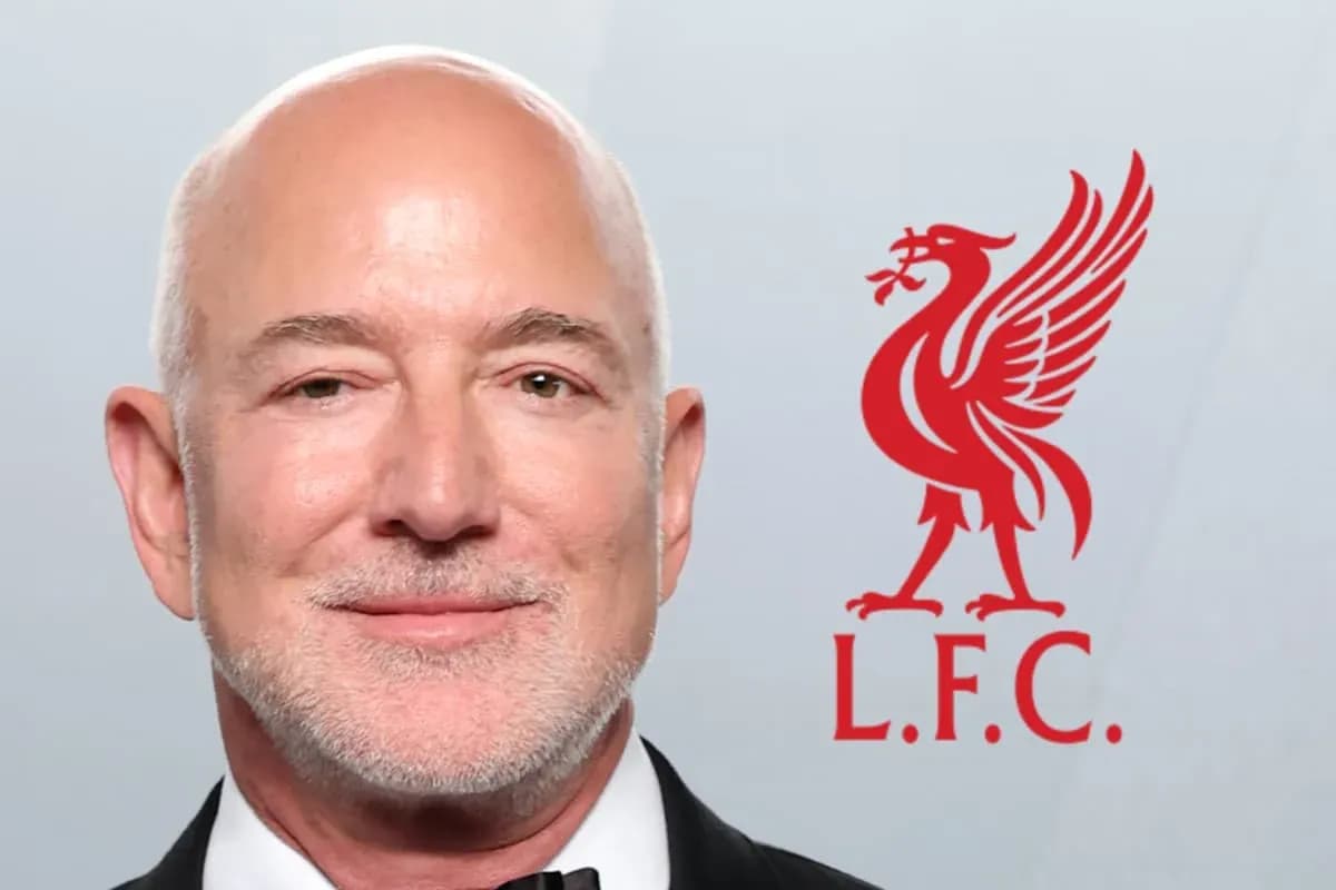 Person smiling next to Liverpool FC logo Person smiling next to Liverpool FC logo