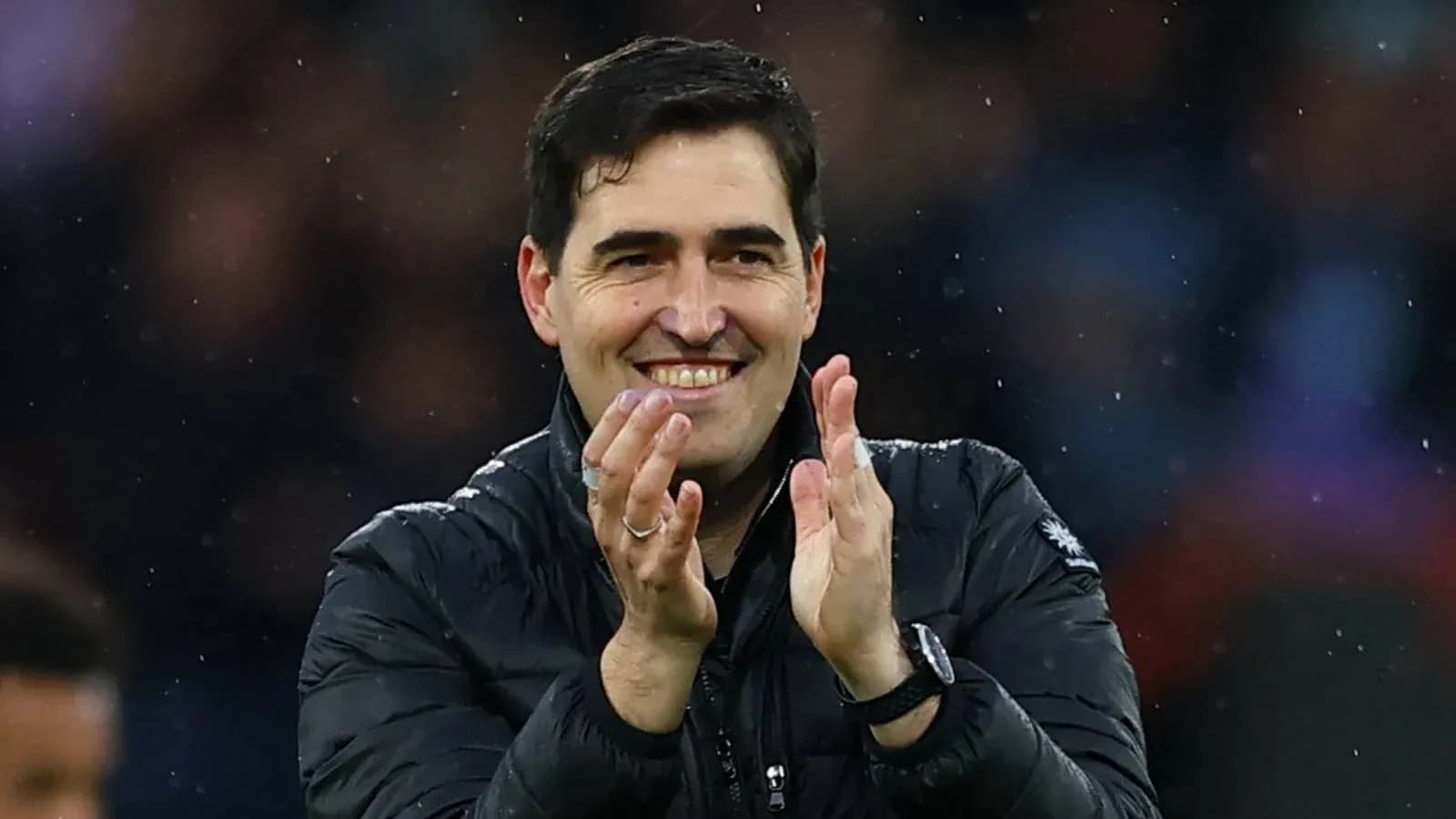Coach applauding in the stadium during match Coach applauding in the stadium during match
