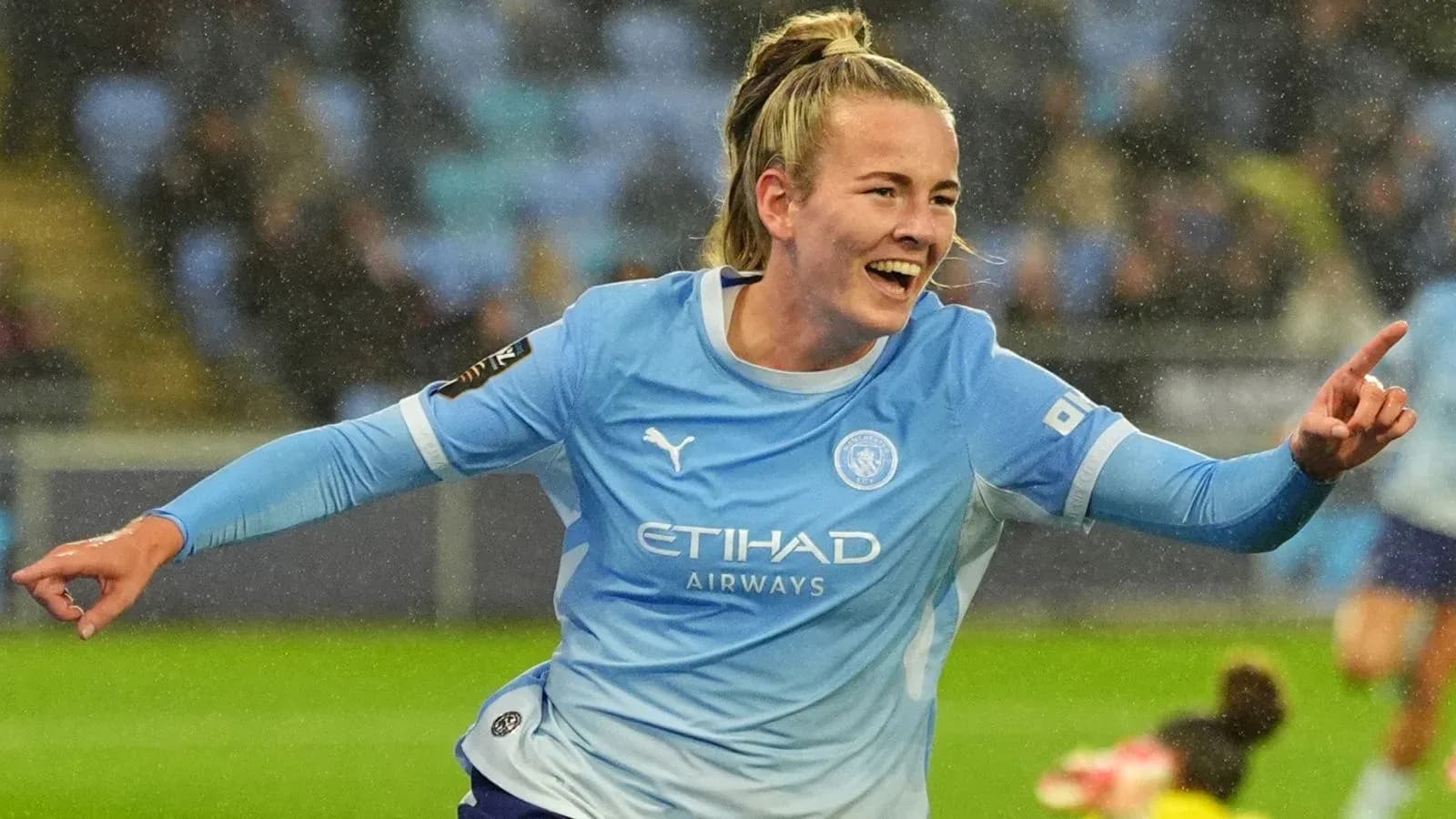 Player celebrating goal in Manchester City kit Player celebrating goal in Manchester City kit