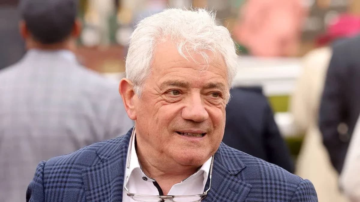 Man with white hair wearing a checkered jacket Man with white hair wearing a checkered jacket