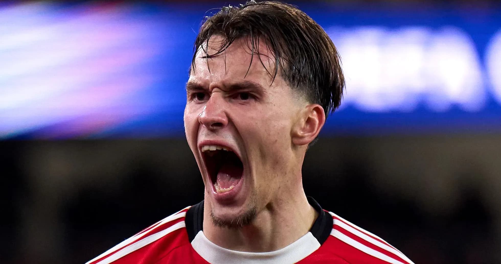 Player celebrating passionately after scoring a goal Player celebrating passionately after scoring a goal