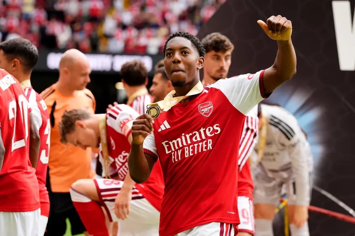 Player celebrating with medal after match Player celebrating with medal after match