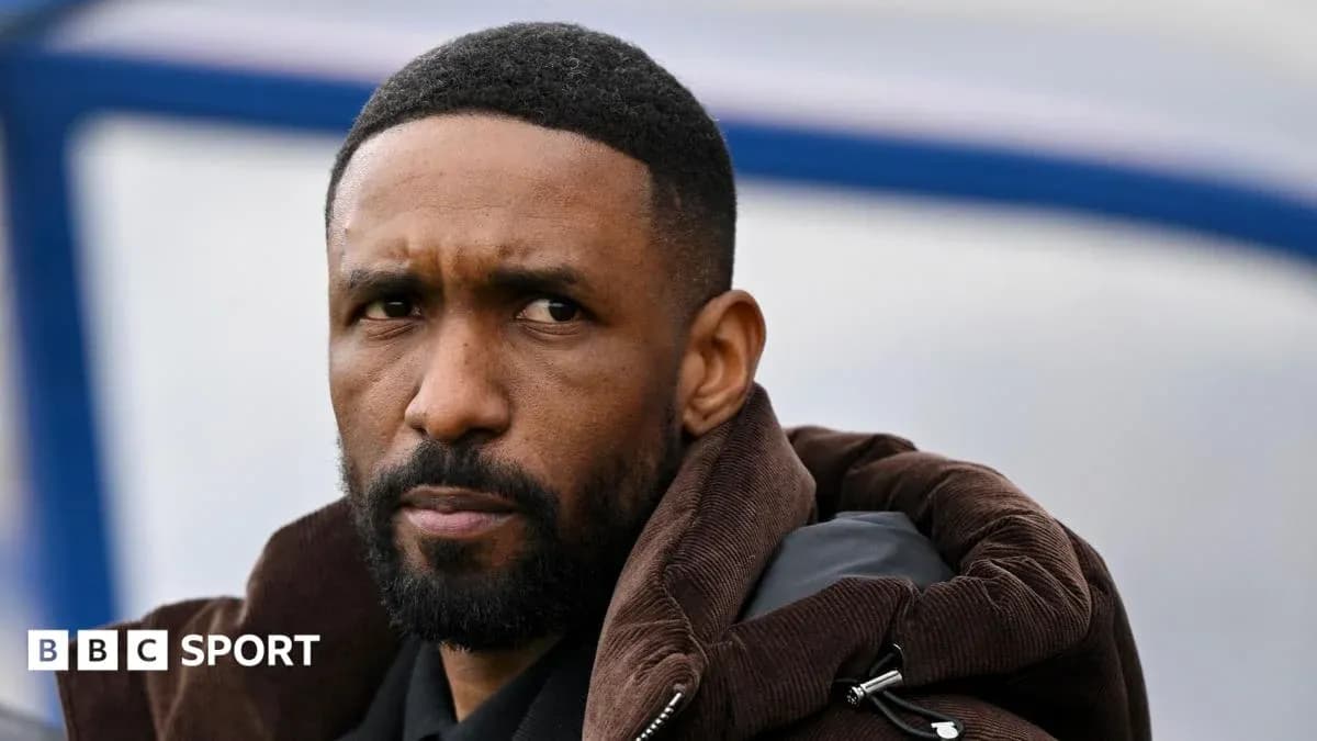 Man with short hair and beard wearing a brown jacket Man with short hair and beard wearing a brown jacket
