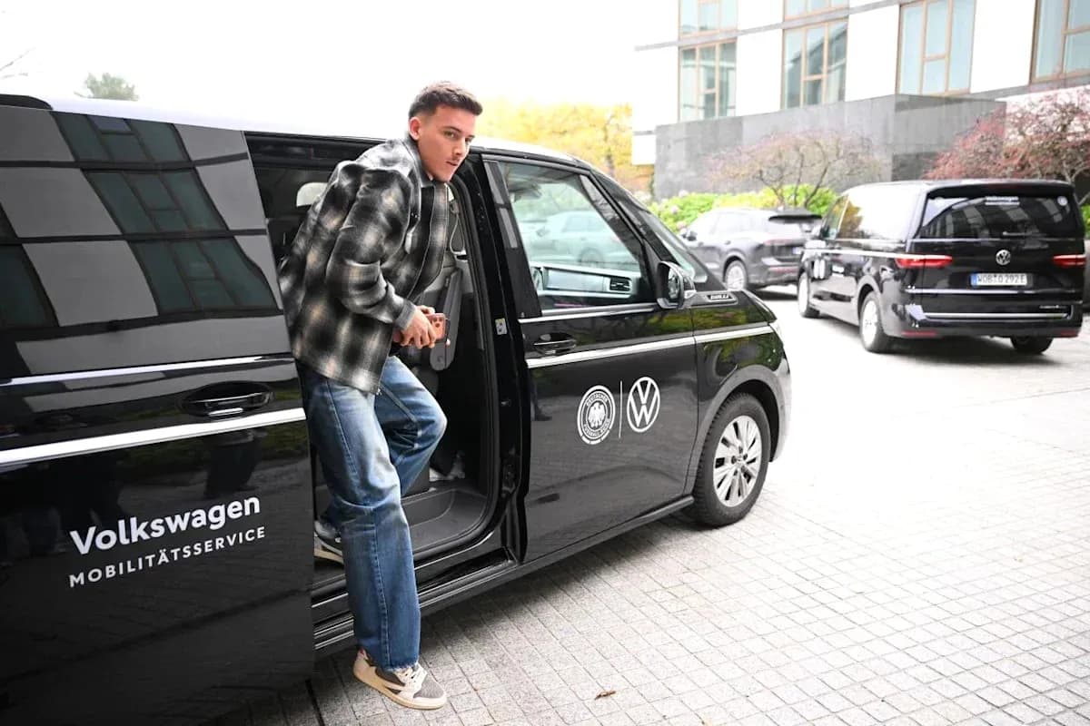 Player exiting Volkswagen vehicle at venue Player exiting Volkswagen vehicle at venue