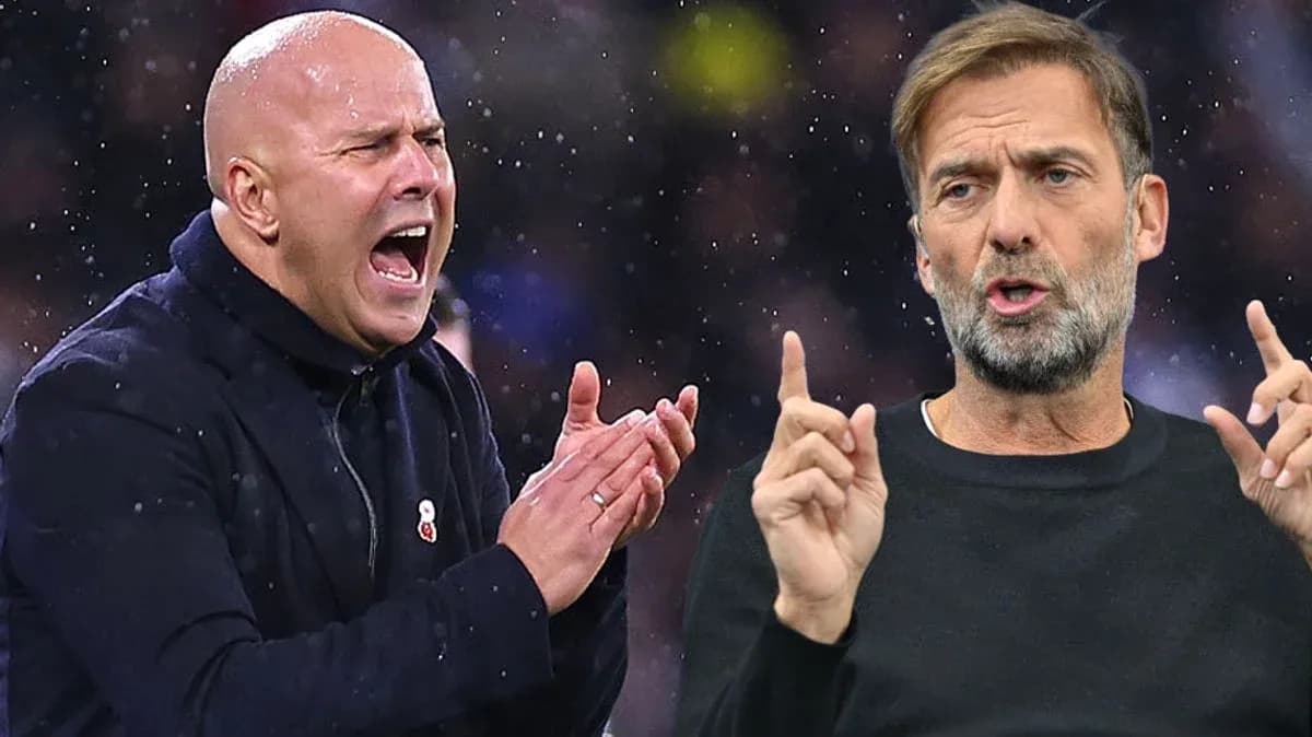 Two football managers discussing during a match Two football managers discussing during a match