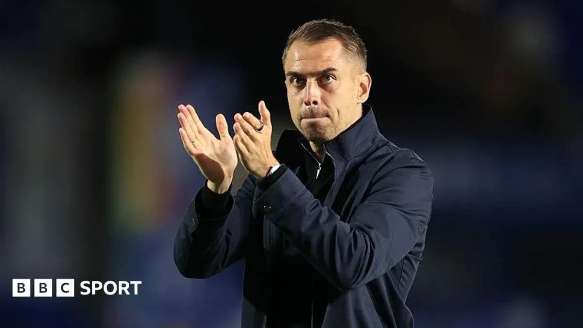 Manager applauding during a match or event Manager applauding during a match or event