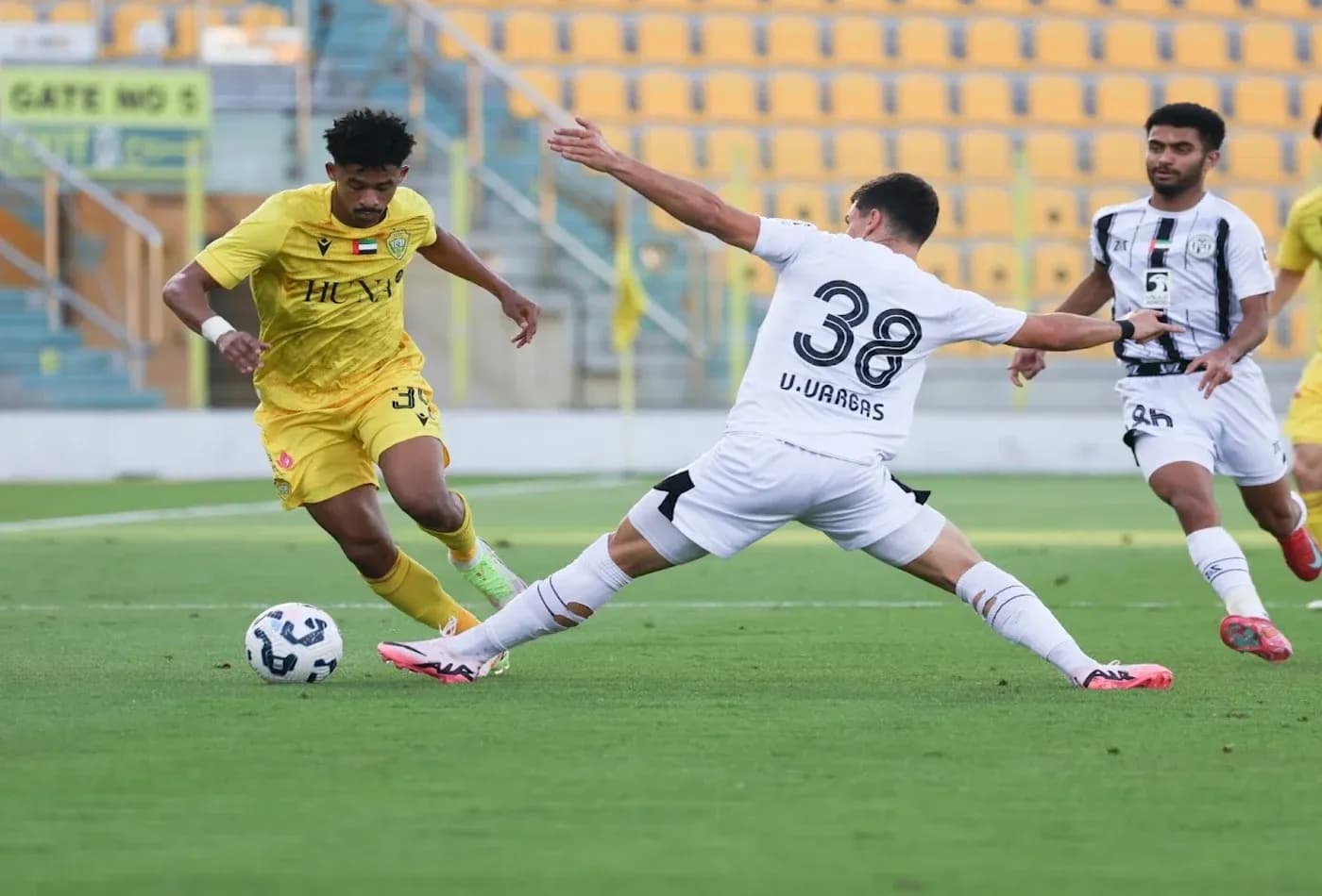 Al Wasl U23 player dribbling past Al Jazira U23 Al Wasl U23 player dribbling past Al Jazira U23