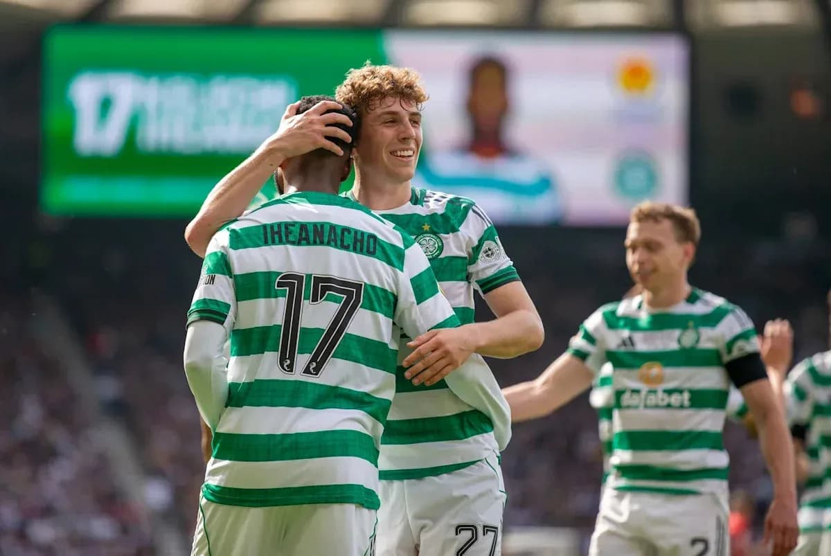 Celtic players celebrating a goal on the field Celtic players celebrating a goal on the field