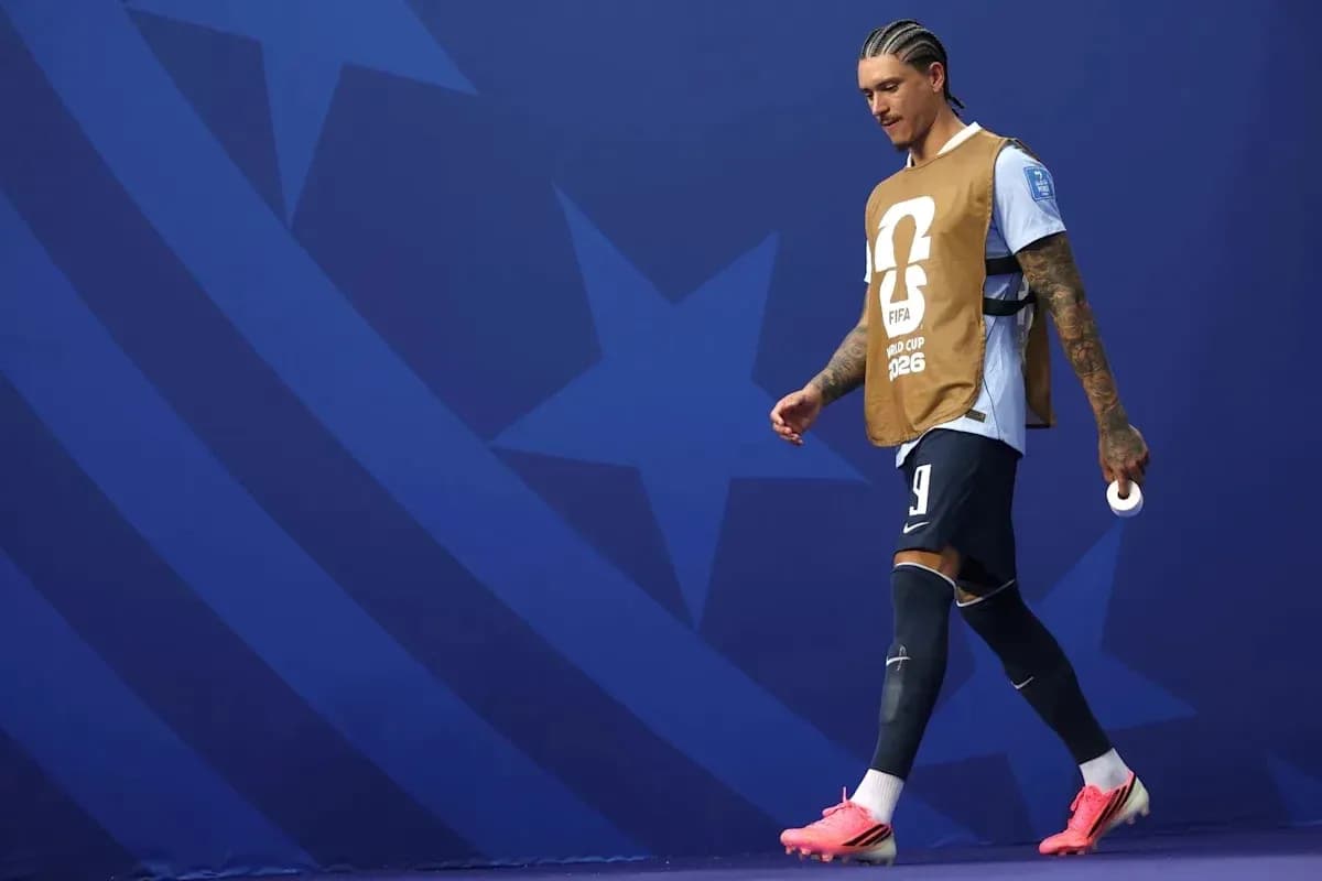 Player walking on field wearing training bib Player walking on field wearing training bib