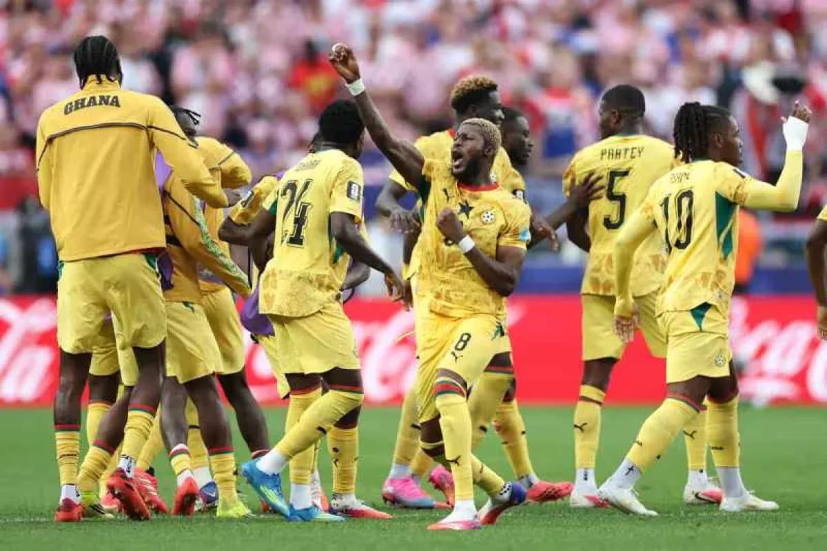 Ghana players celebrating during a football match Ghana players celebrating during a football match