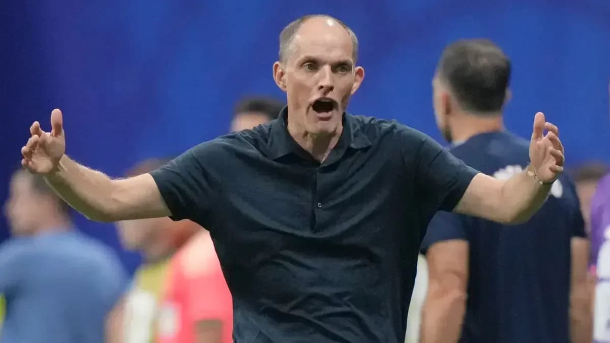 Coach gesturing animatedly during a match Coach gesturing animatedly during a match