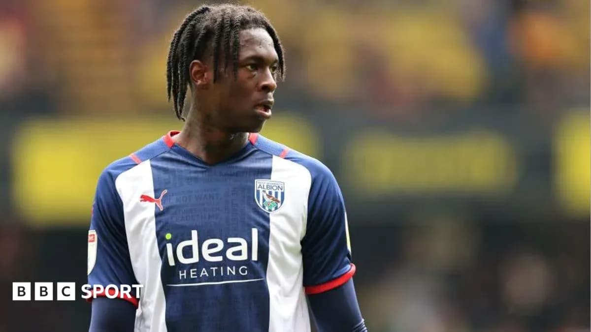Player in West Bromwich Albion kit on the field Player in West Bromwich Albion kit on the field