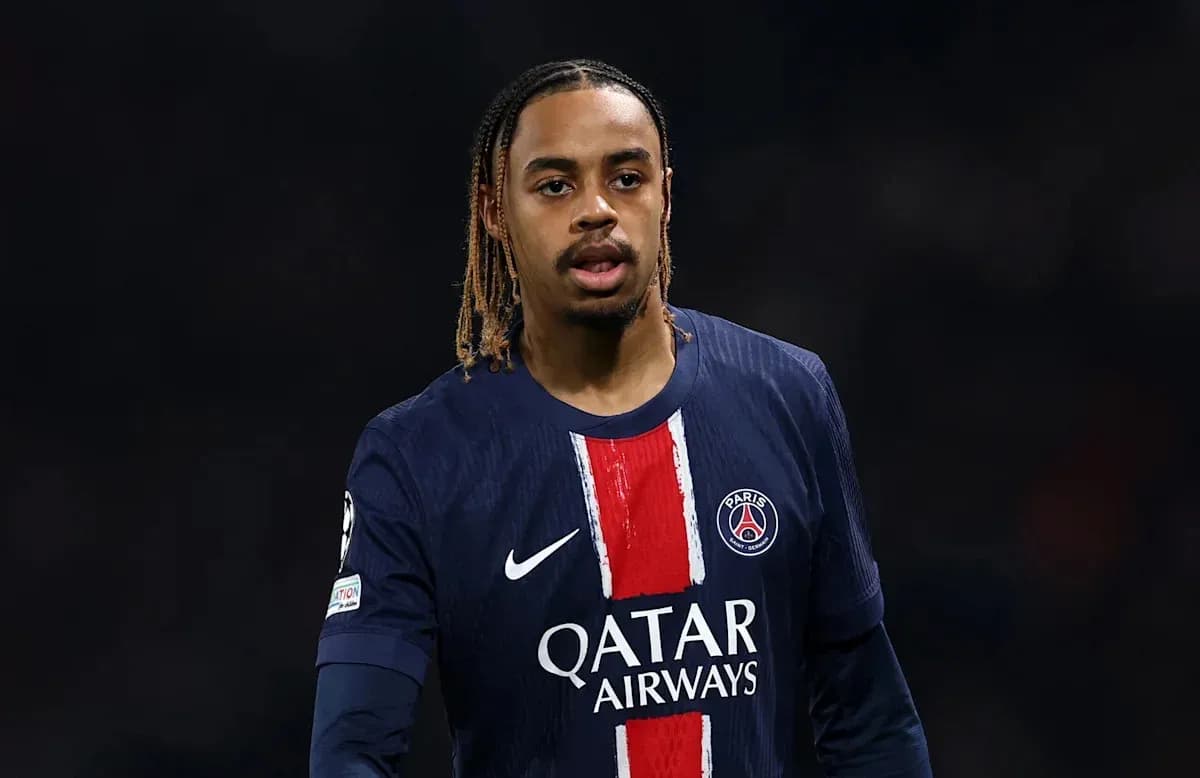 Player in PSG jersey during match action Player in PSG jersey during match action