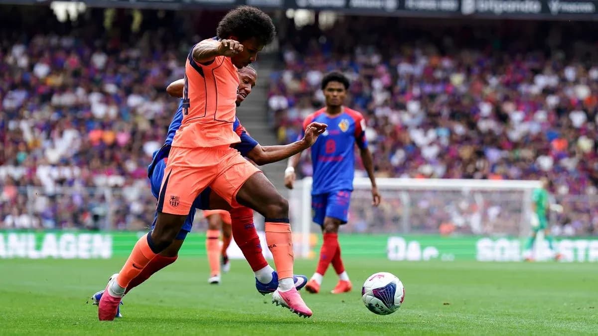 Player tackling opponent during a football match Player tackling opponent during a football match