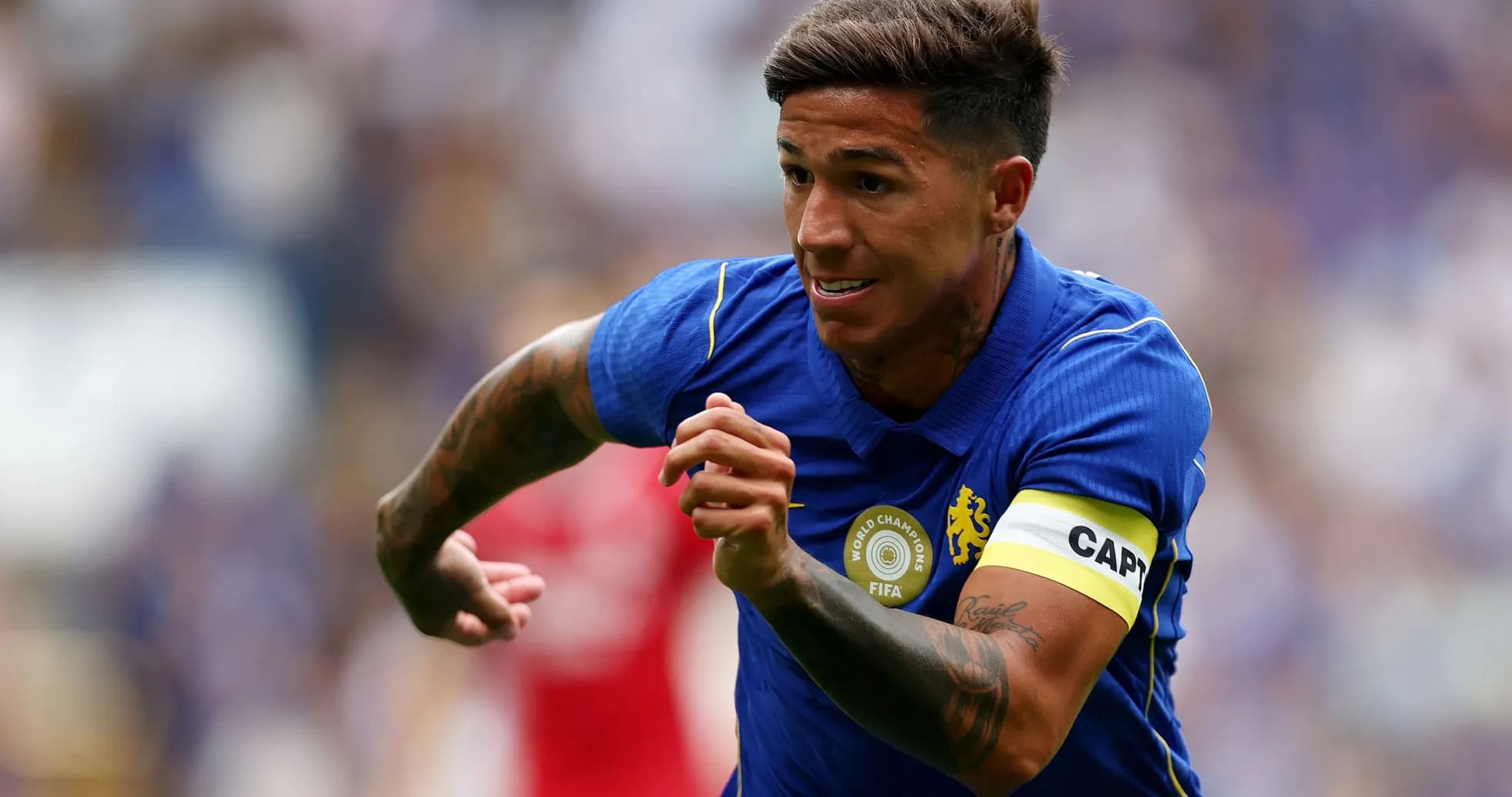 Player sprinting in blue jersey during match Player sprinting in blue jersey during match