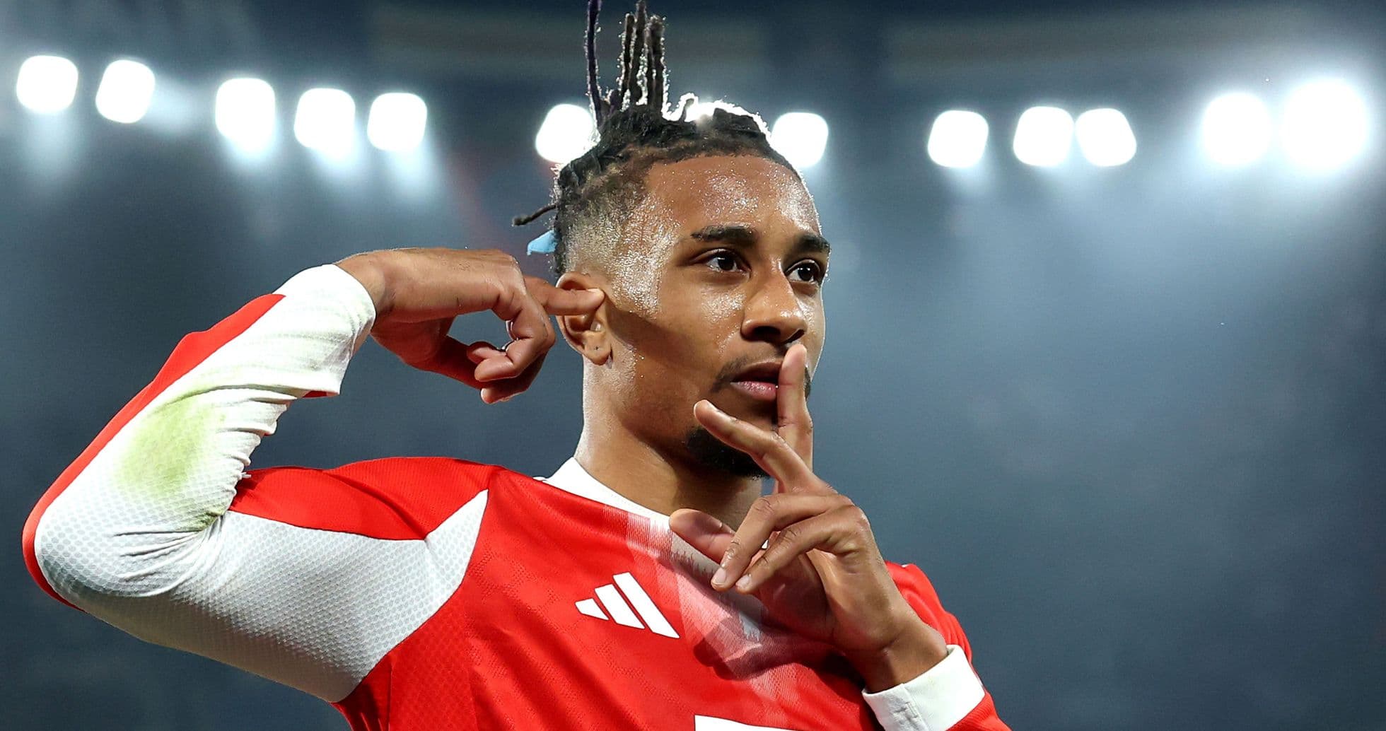 Player celebrating with a shushing gesture Player celebrating with a shushing gesture
