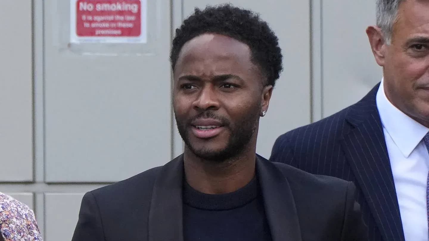Man in suit walking outside with another person Man in suit walking outside with another person