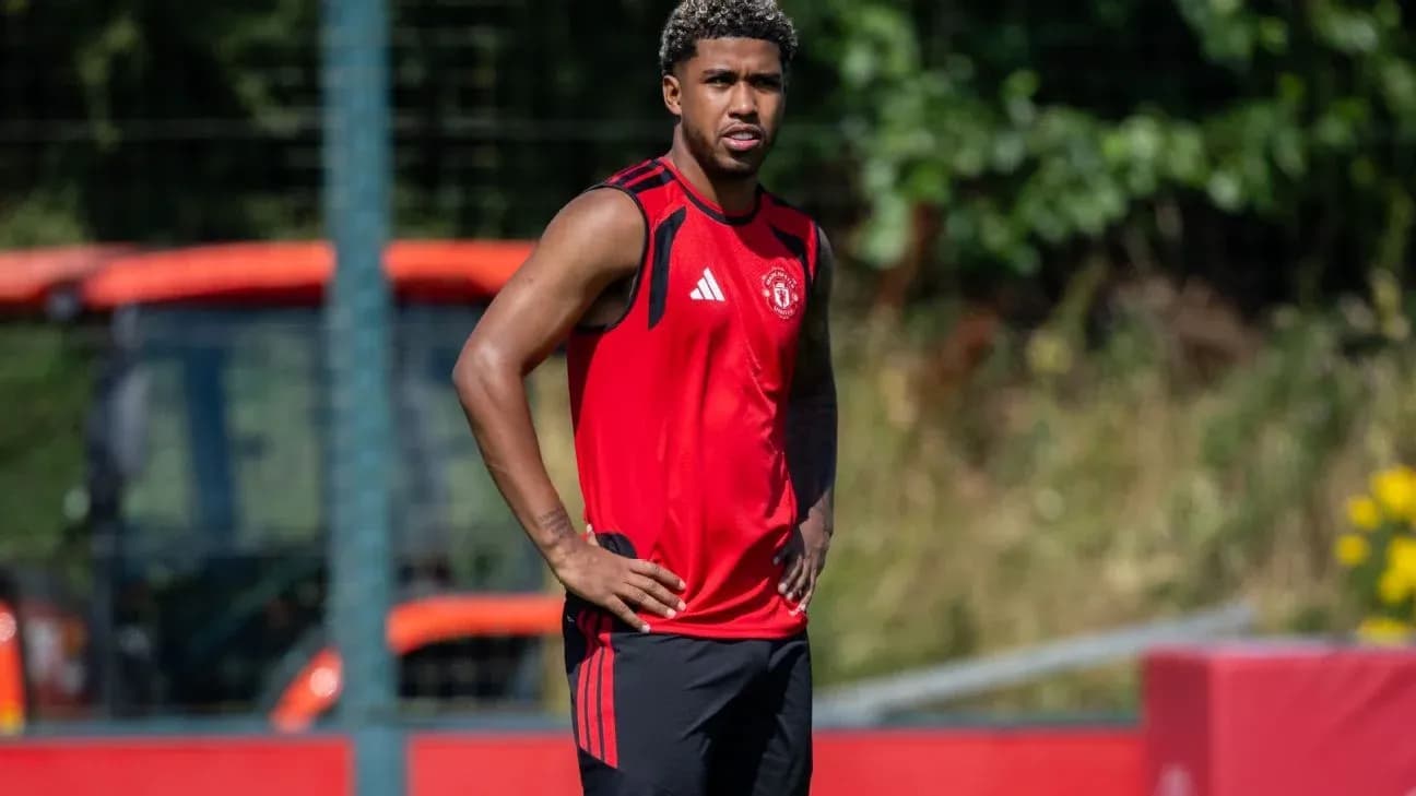Player in red training kit at practice session Player in red training kit at practice session