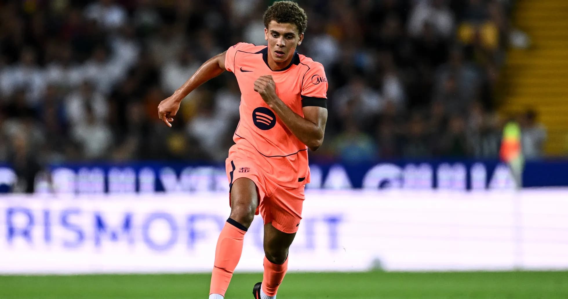 Player running with the ball during a match Player running with the ball during a match