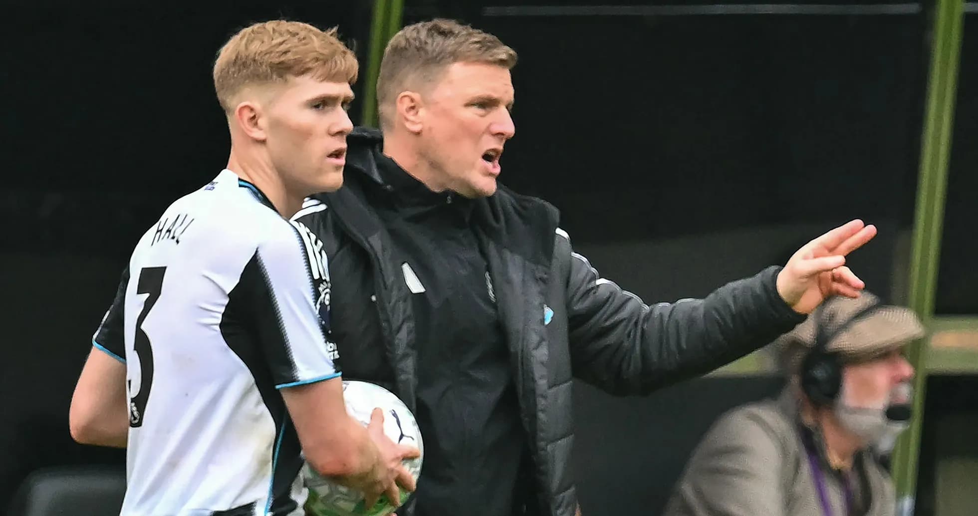 Coach instructing player during match substitution Coach instructing player during match substitution