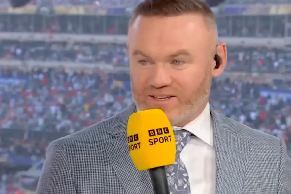 Sports commentator speaking into microphone during broadcast Sports commentator speaking into microphone during broadcast