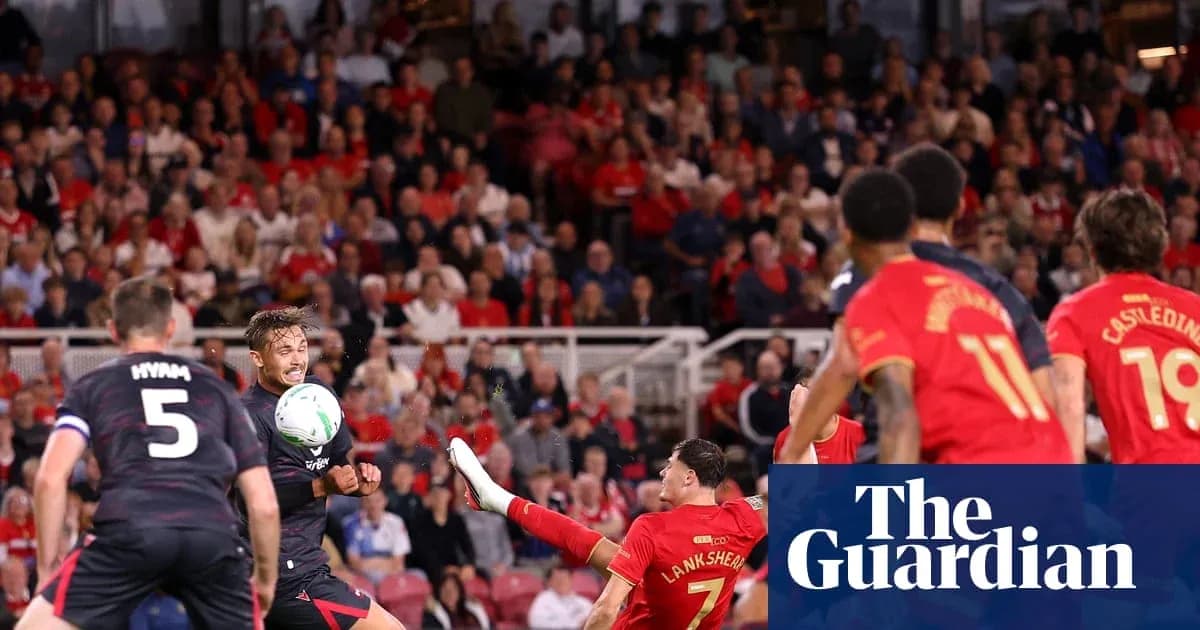 Players contesting for the ball during a match Players contesting for the ball during a match