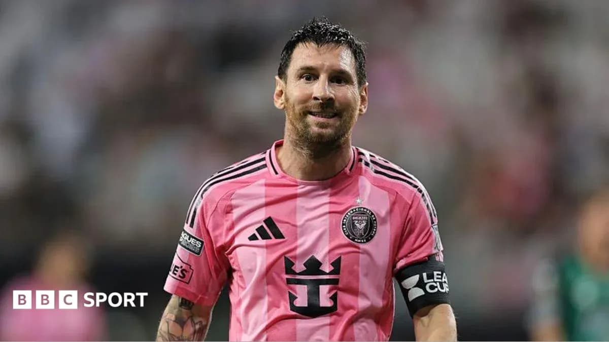 Player in pink jersey celebrating on the field Player in pink jersey celebrating on the field