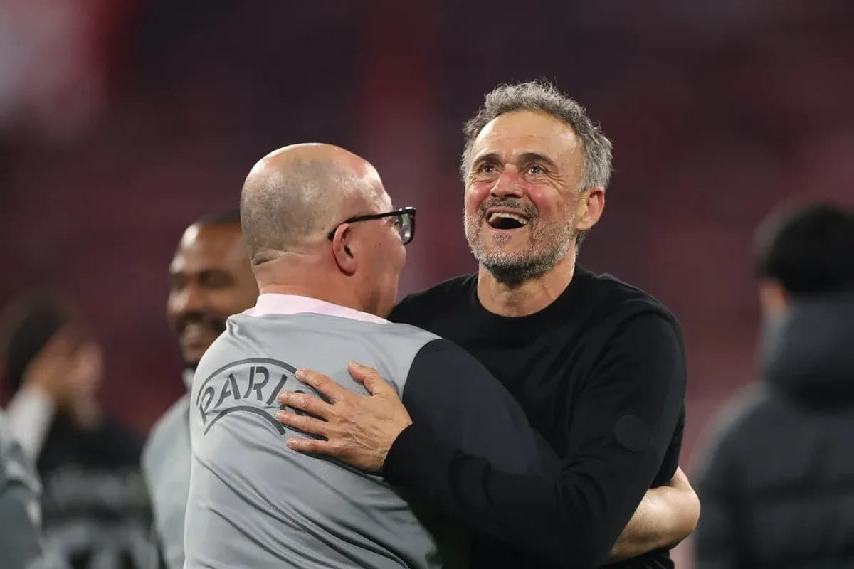 Coaches celebrating with an embrace after match Coaches celebrating with an embrace after match