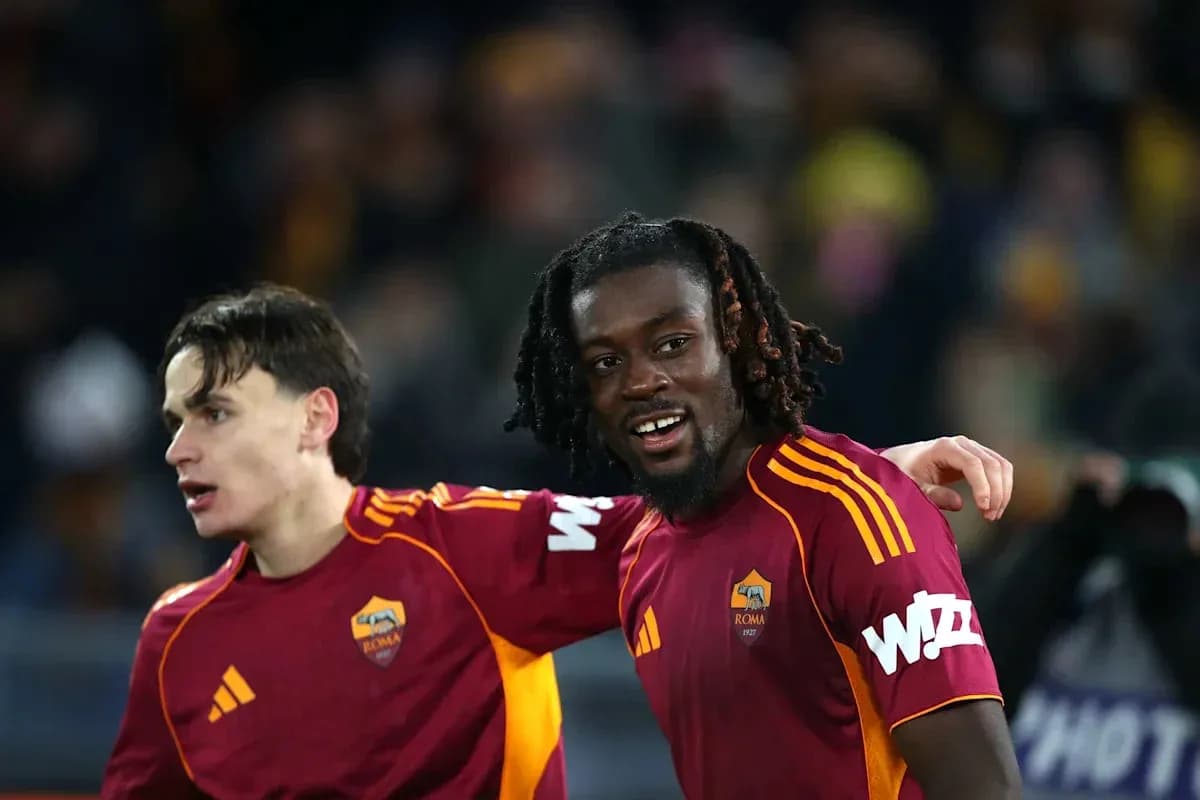 Two AS Roma players celebrating after a match Two AS Roma players celebrating after a match