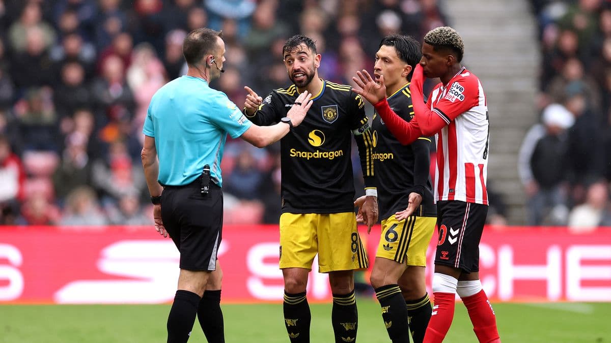 Players arguing with referee during match incident Players arguing with referee during match incident