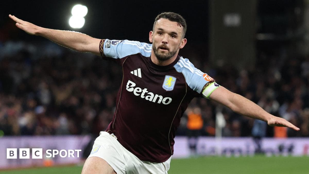 Aston Villa player celebrating a goal on pitch Aston Villa player celebrating a goal on pitch