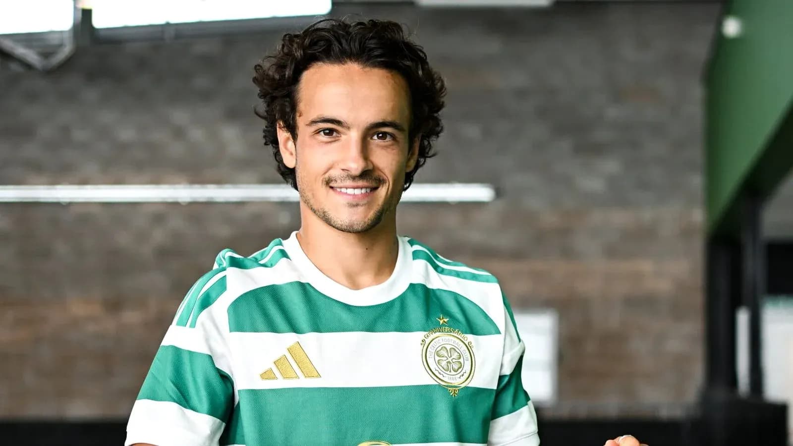 Player posing in green and white striped jersey Player posing in green and white striped jersey