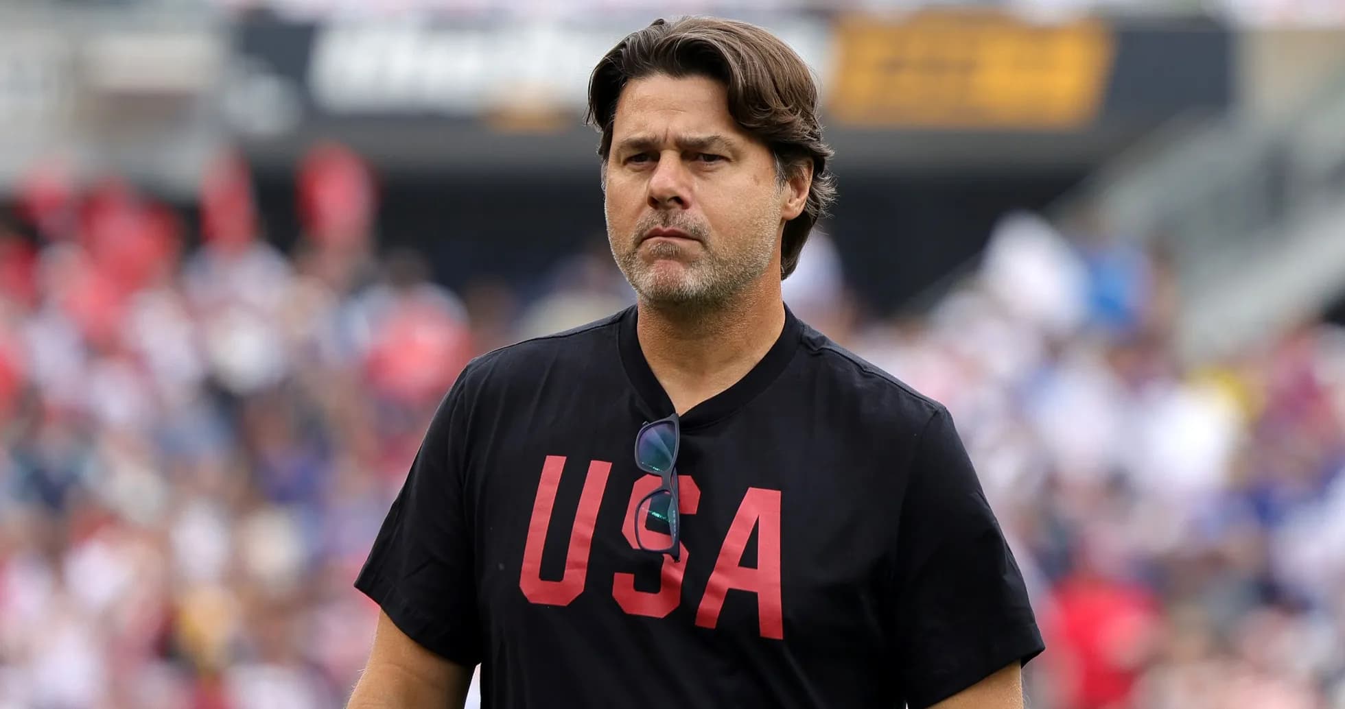 Coach walking on the field during match Coach walking on the field during match