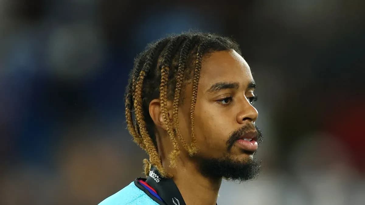 Player with braided hair in sports attire Player with braided hair in sports attire