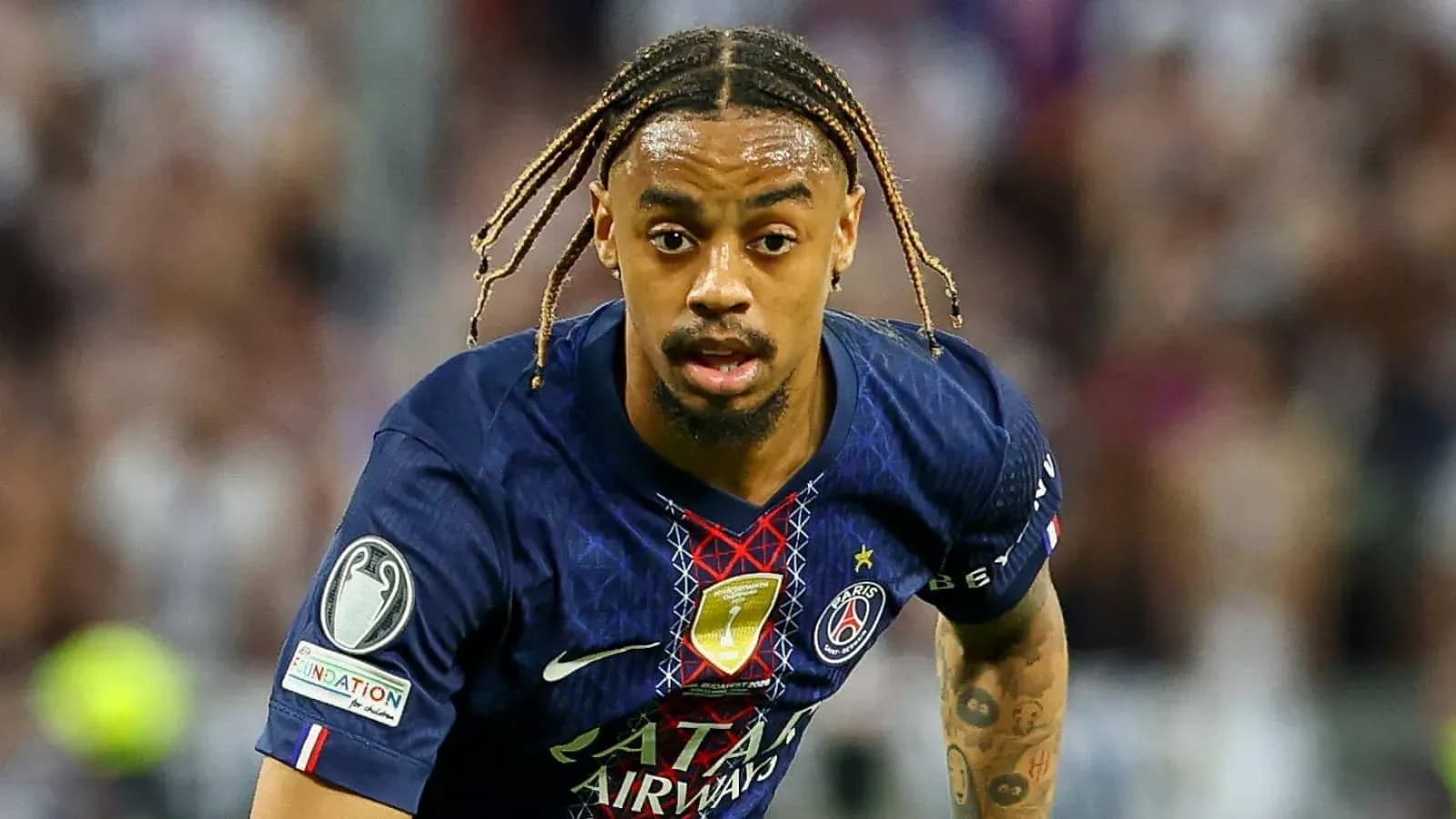Player running with ball during match for PSG Player running with ball during match for PSG