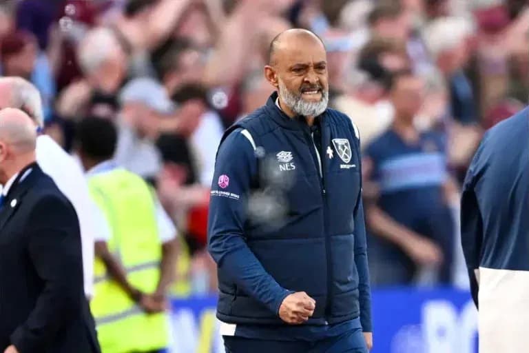 Manager celebrating on the sidelines during match Manager celebrating on the sidelines during match