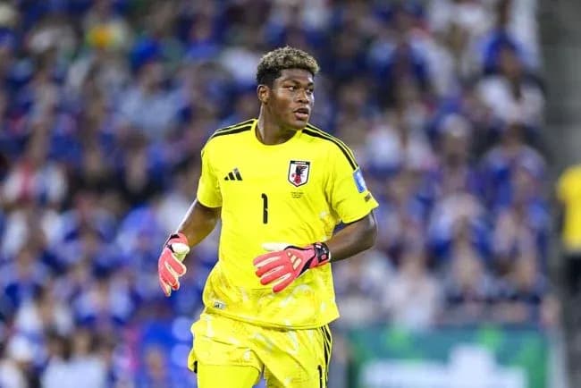 Goalkeeper in yellow jersey during match action Goalkeeper in yellow jersey during match action
