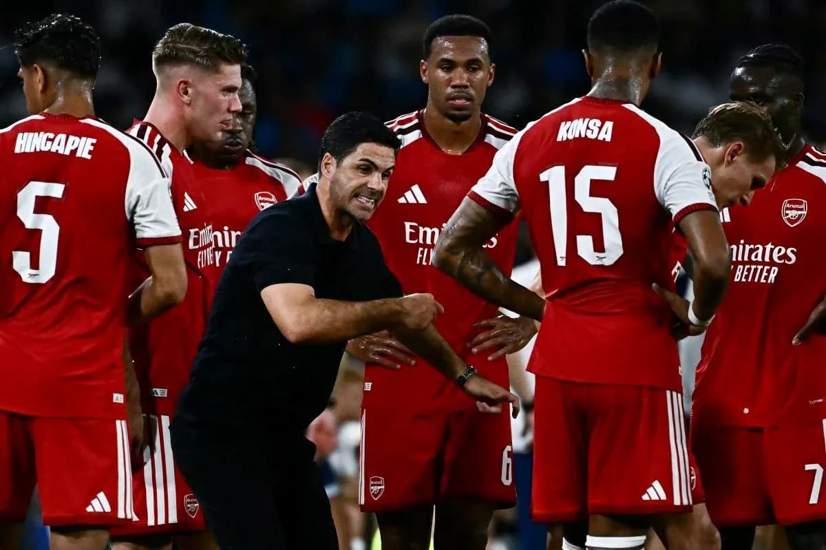 Arsenal players listening to manager during team huddle Arsenal players listening to manager during team huddle